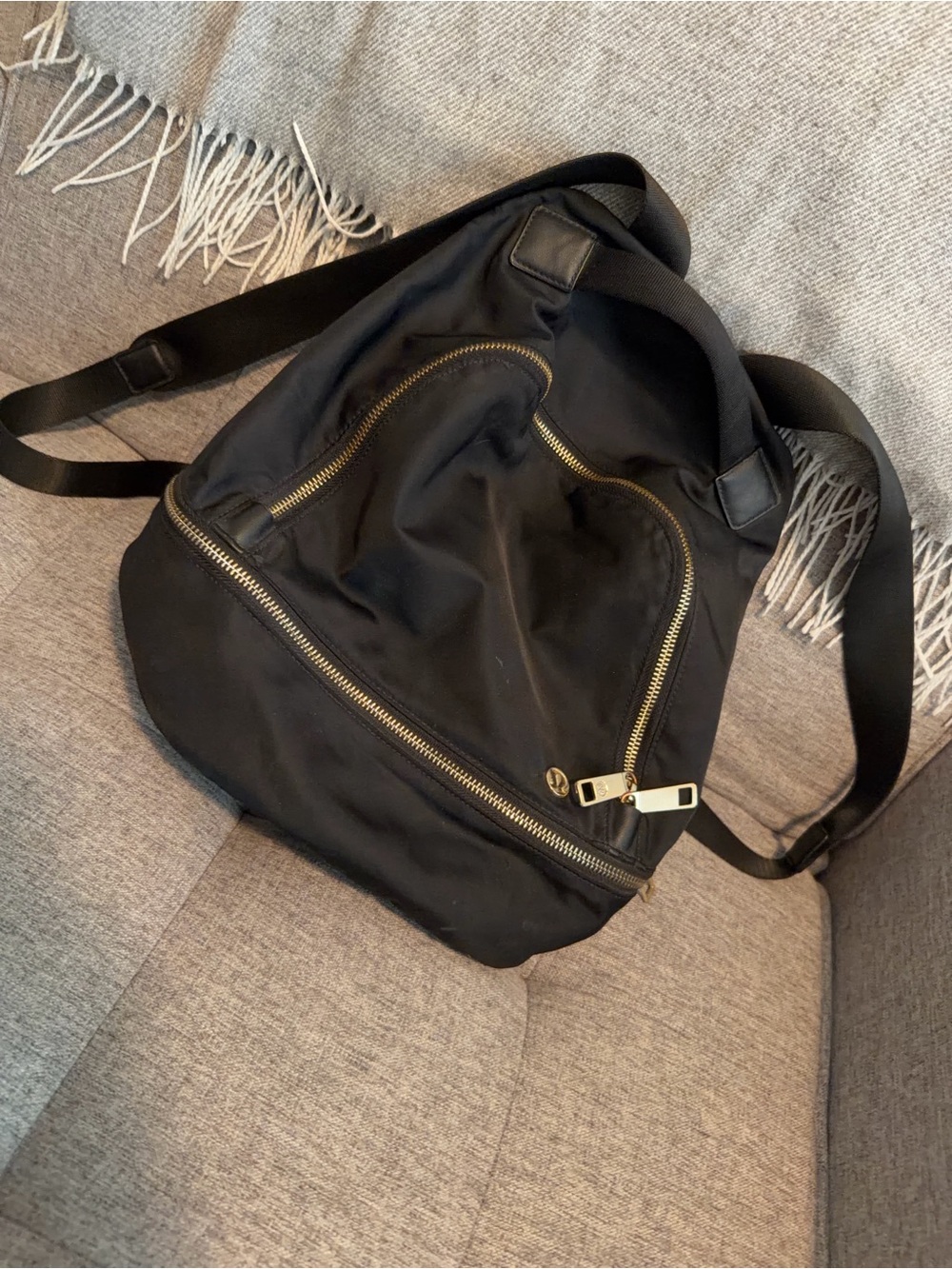 lululemon athletica Black Sling Backpack with Gold Zippers